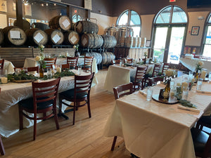 photo of barrel room decorated for rehearsal dinner in taproom of cherry street brewing in vickery village cumming georgia