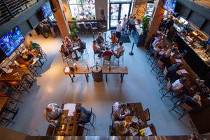 photo of brewhouse with people eating and drinking 