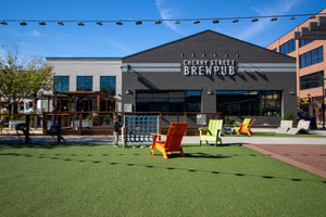 photo of cherry street brewpub at halcyon storefront with greenspace in front